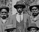 A group of Aborigines in Eurpean dress outside the Coranderrk mission. A group of Aborigines in Eurpean dress outside the Coranderrk mission.