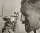 Captain John King Davis using a sighting compass.