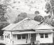 Photograph of a house being transported on a truck form the site of Tallangatta.