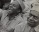 Photograph of American soldiers watching a comedy show.